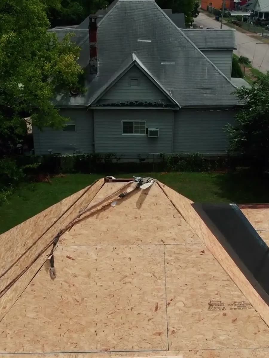 Fresh roof decking on a home surrounded by trees