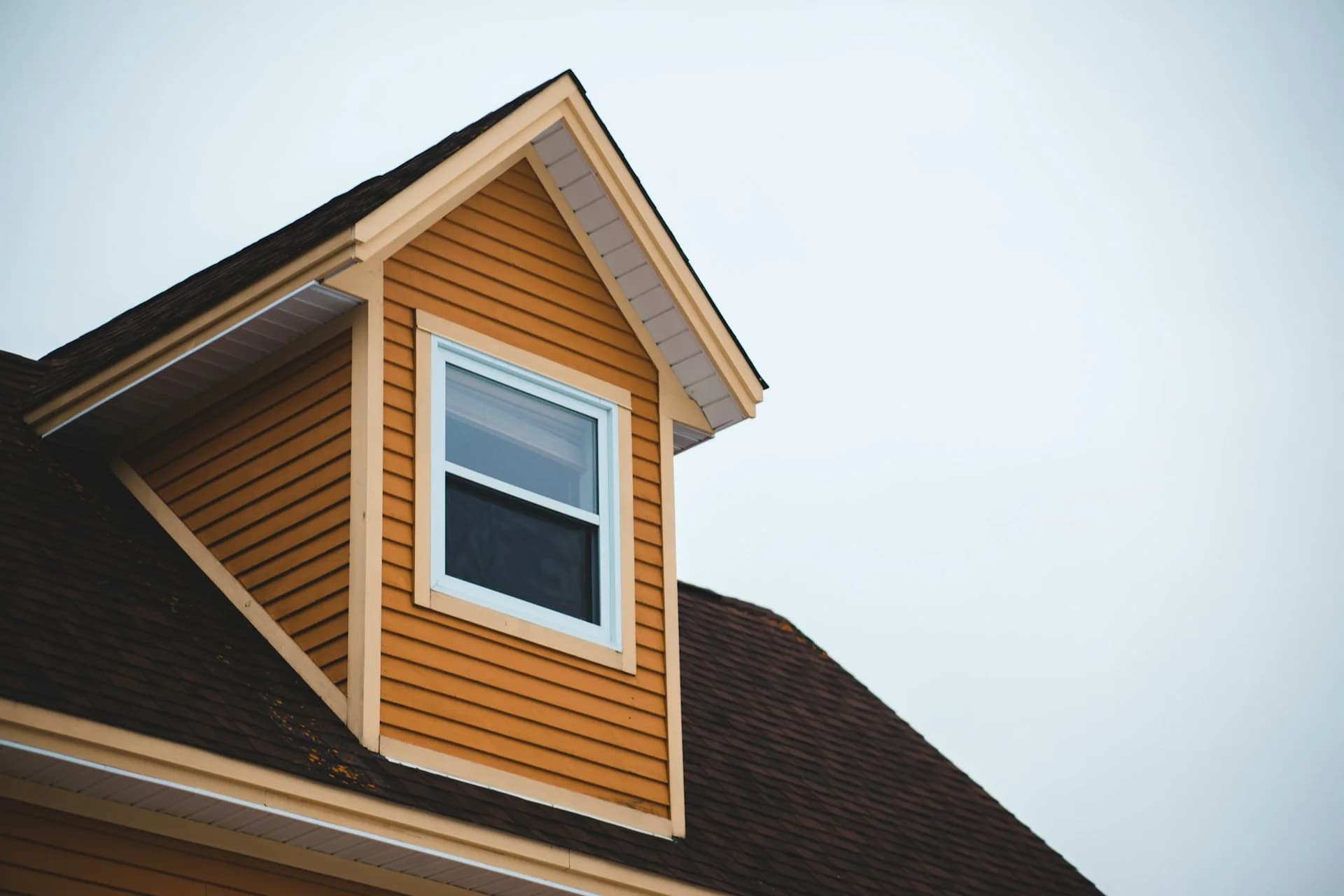 Warm wood-look siding on a dormer